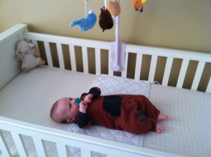 Henry loves his mobile, but he's not so sure about the crib yet!